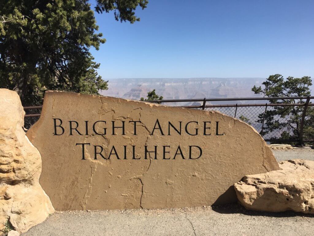 trailhead sign on rock