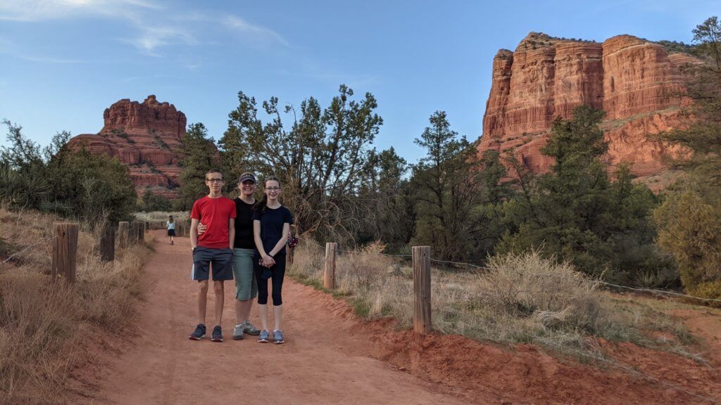 people on a red path with red mountains