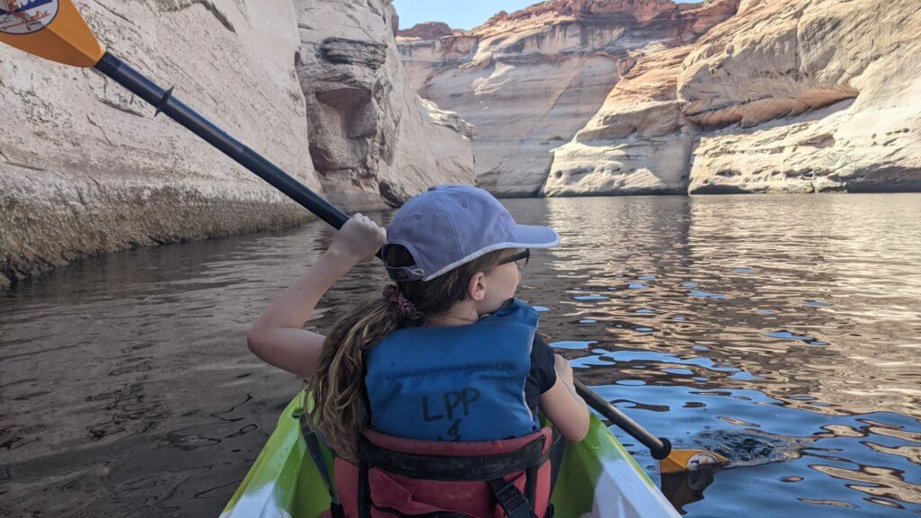 girl paddling a kayak