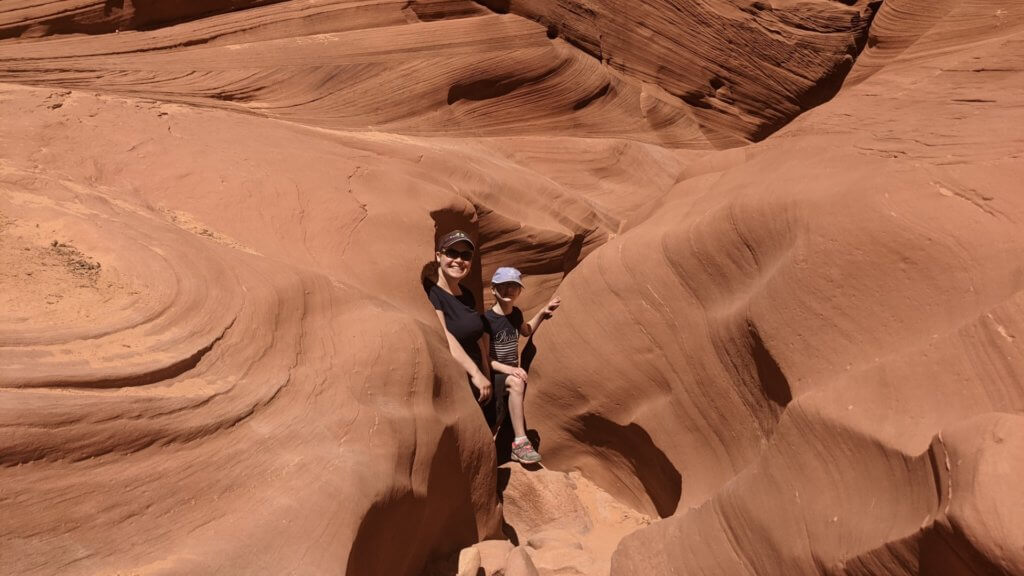 mother and daughter in narrow canyon