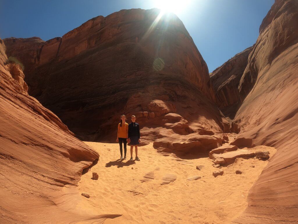 boy and girl standing in canyon