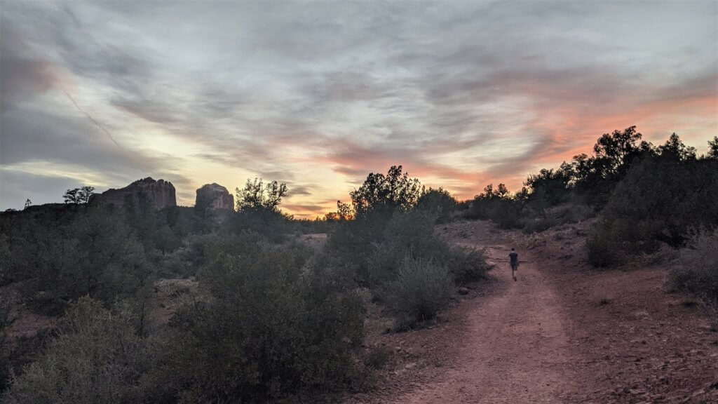 boy on trail at sunset