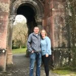 couple in front of old building