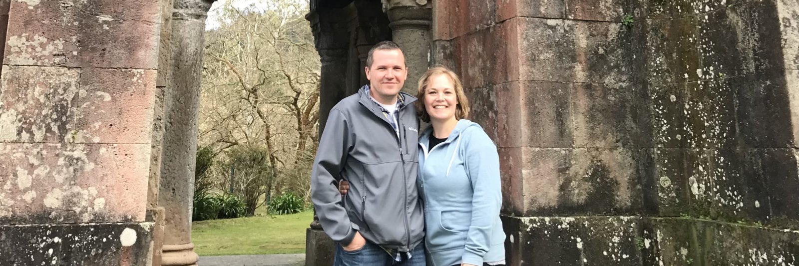 couple in front of old building