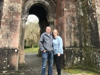 couple in front of old building