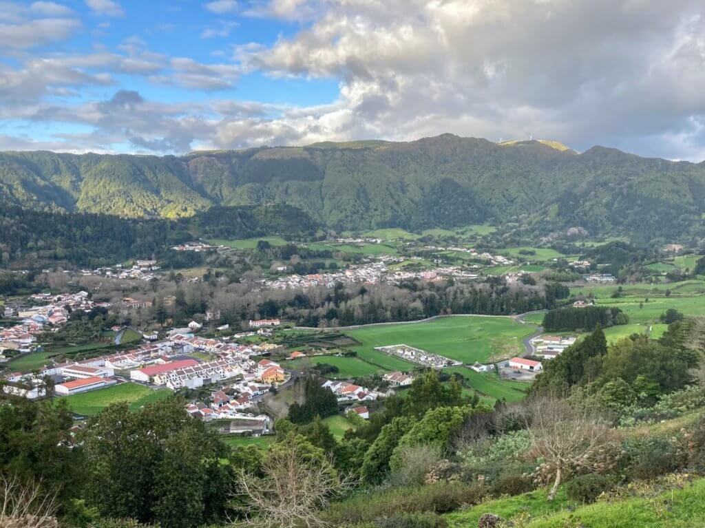 small town surrounded by green mountains